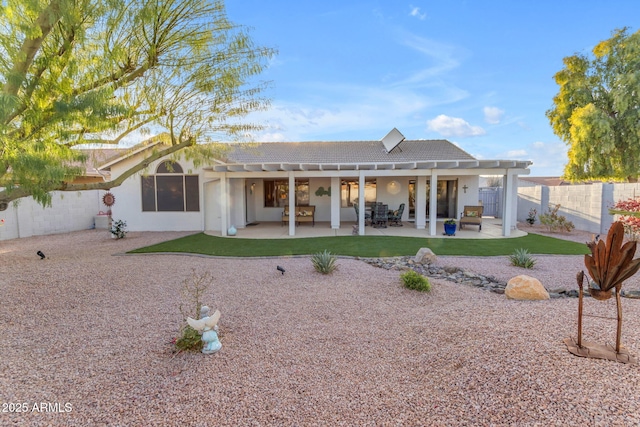 rear view of house featuring a patio area