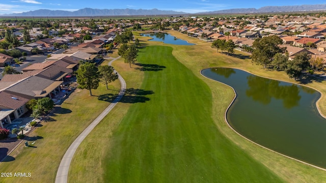 drone / aerial view with a water and mountain view