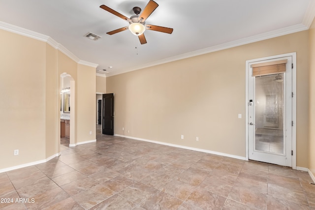 empty room featuring crown molding and ceiling fan