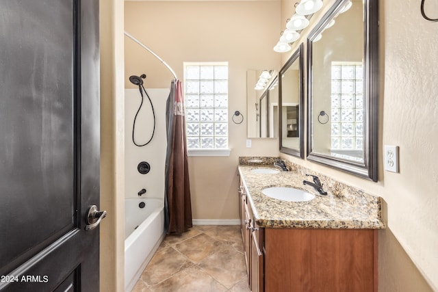 bathroom featuring vanity, shower / bath combo, and tile patterned flooring