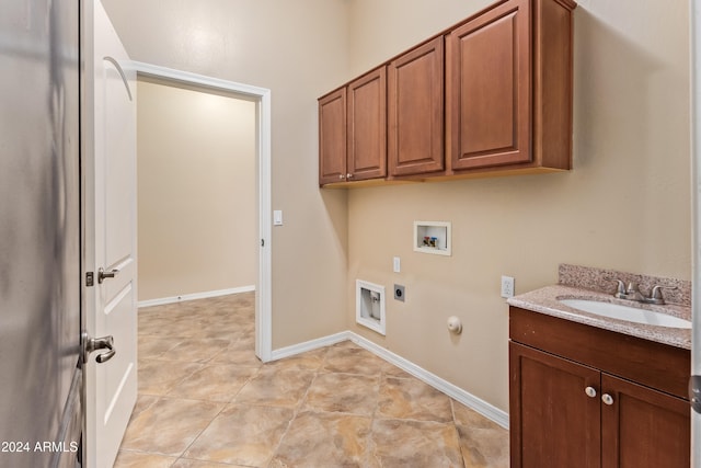 laundry room featuring cabinets, washer hookup, electric dryer hookup, hookup for a gas dryer, and sink