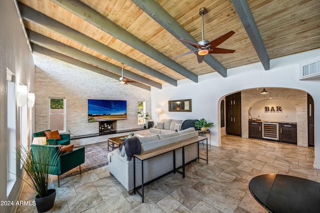 living room with beam ceiling, high vaulted ceiling, and wooden ceiling