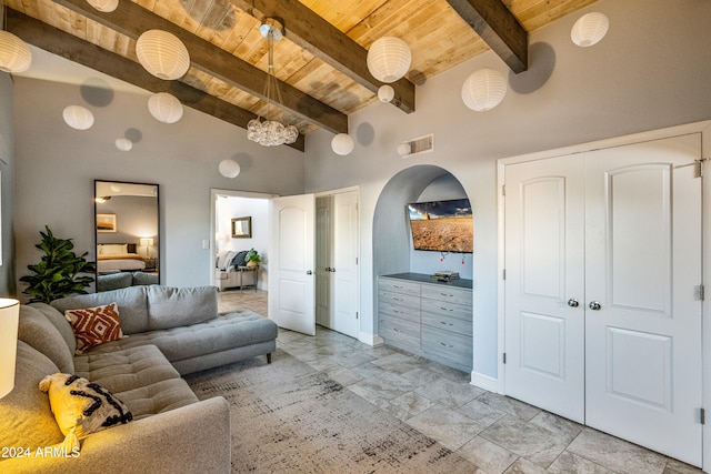 living area with high vaulted ceiling, arched walkways, wooden ceiling, beam ceiling, and visible vents