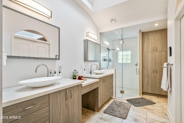 bathroom featuring vanity, lofted ceiling, and a shower with shower door