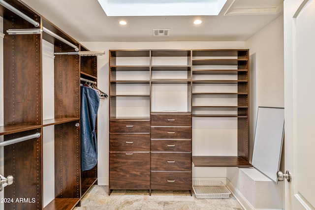 spacious closet with visible vents and a skylight