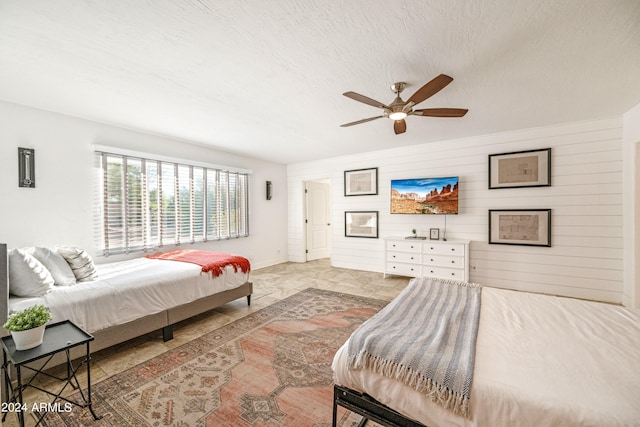 bedroom featuring a ceiling fan and baseboards