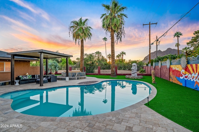 view of swimming pool featuring a fenced in pool, a fenced backyard, a lawn, a patio, and an outdoor living space