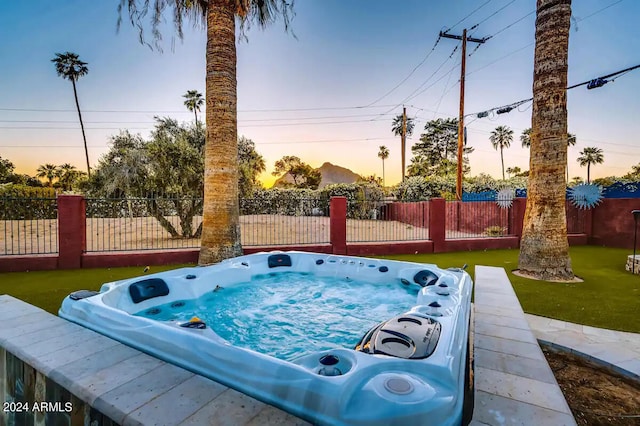 view of swimming pool featuring fence private yard and a hot tub