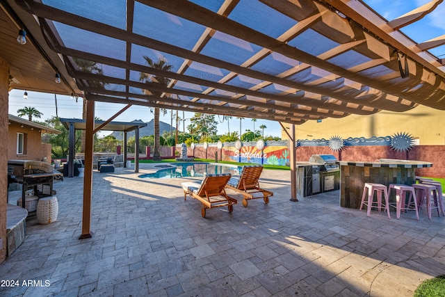 view of patio with a pergola, a fenced backyard, outdoor dry bar, and an outdoor pool