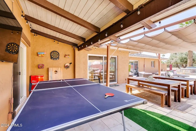 game room with track lighting, vaulted ceiling with beams, wooden ceiling, and tile patterned floors