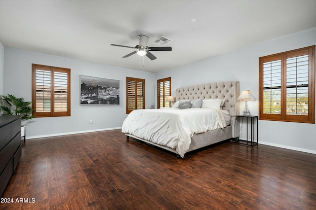 bedroom with ceiling fan and dark hardwood / wood-style floors