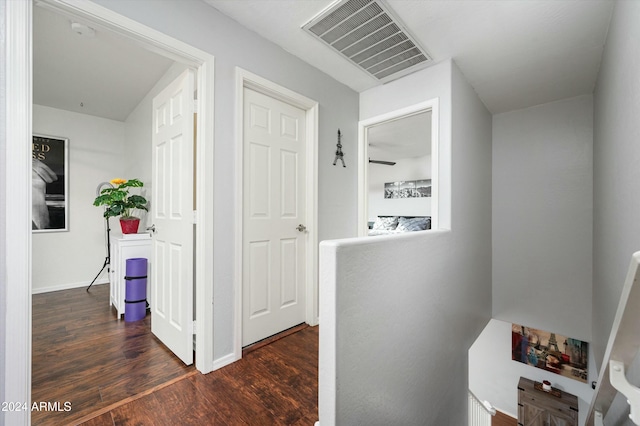 hall with dark wood-type flooring