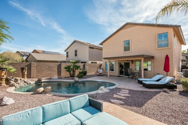 view of pool featuring a patio area, pool water feature, and central AC