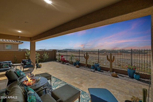 patio terrace at dusk with an outdoor fire pit