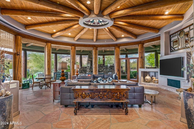 sunroom with beamed ceiling and wooden ceiling