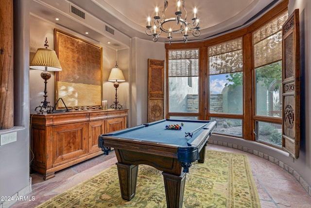 playroom with a tray ceiling, a notable chandelier, and billiards