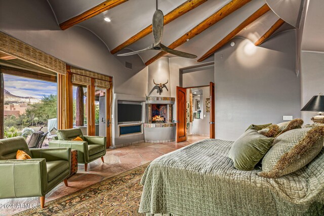 bedroom with beamed ceiling and high vaulted ceiling