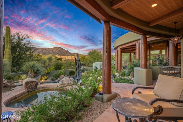 patio terrace at dusk with a mountain view