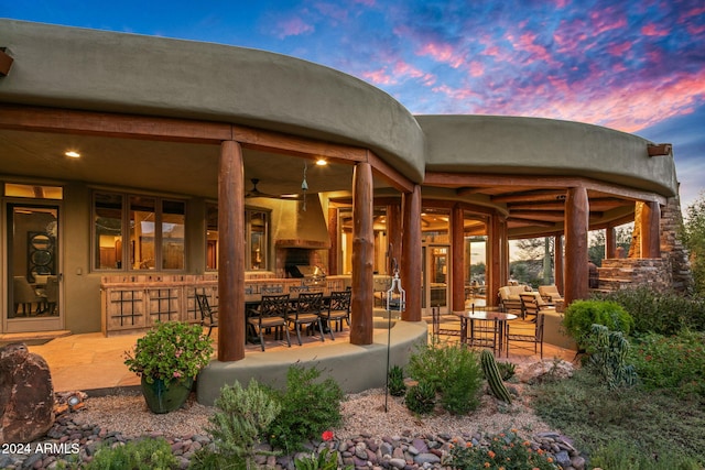 exterior space with ceiling fan