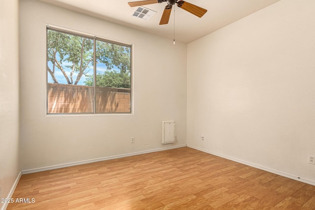 spare room featuring ceiling fan and light hardwood / wood-style floors