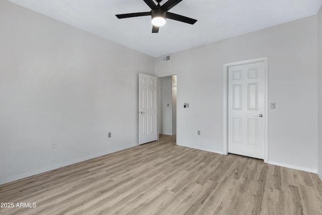 unfurnished bedroom with ceiling fan and light wood-type flooring