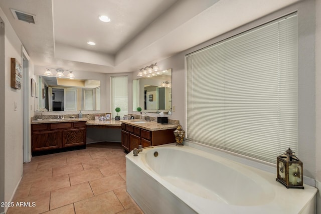 4601 E Sunnyside Ln, Phoenix, AZ 85032 - bathroom featuring a garden tub, vanity, tile patterned floors, and recessed lighting