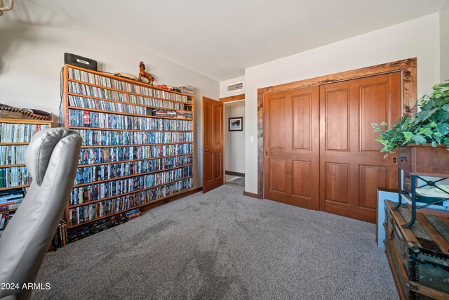 interior space with baseboards, visible vents, and carpet floors