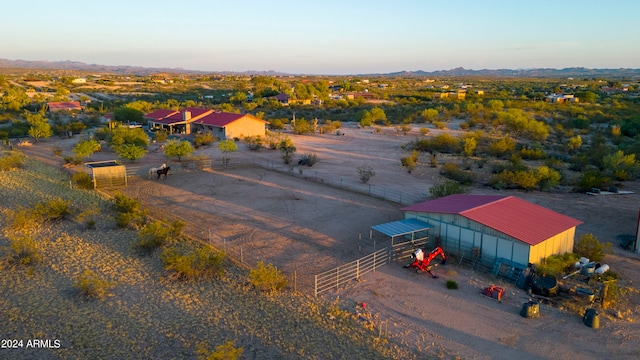 birds eye view of property with a rural view and a mountain view