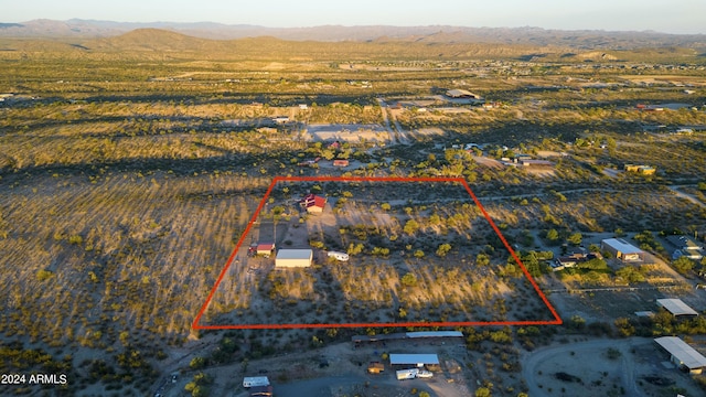 birds eye view of property with a mountain view