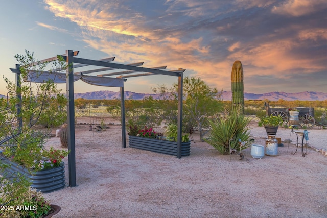 exterior space with a pergola and a mountain view