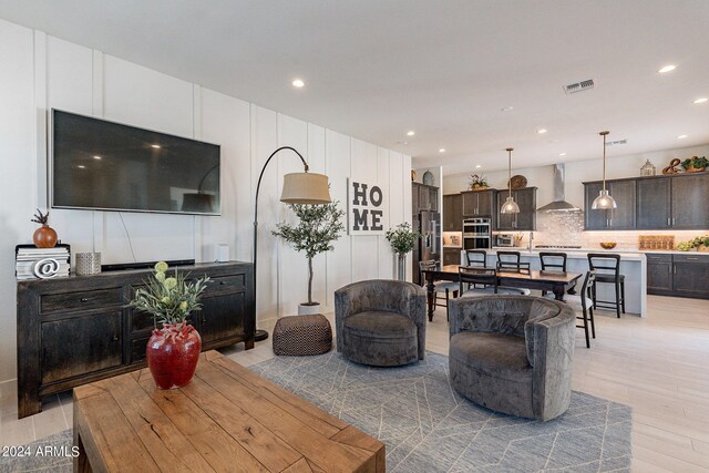 living room with light hardwood / wood-style flooring