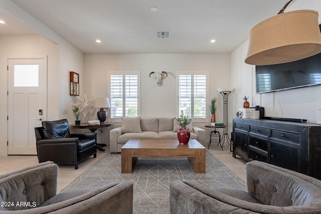 living room with light hardwood / wood-style floors