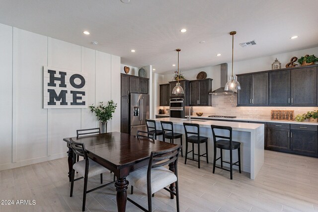 dining room with light hardwood / wood-style floors and sink