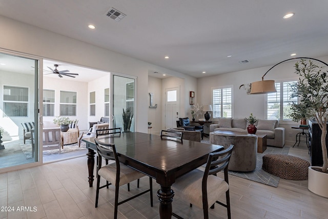 dining area featuring light hardwood / wood-style flooring and ceiling fan