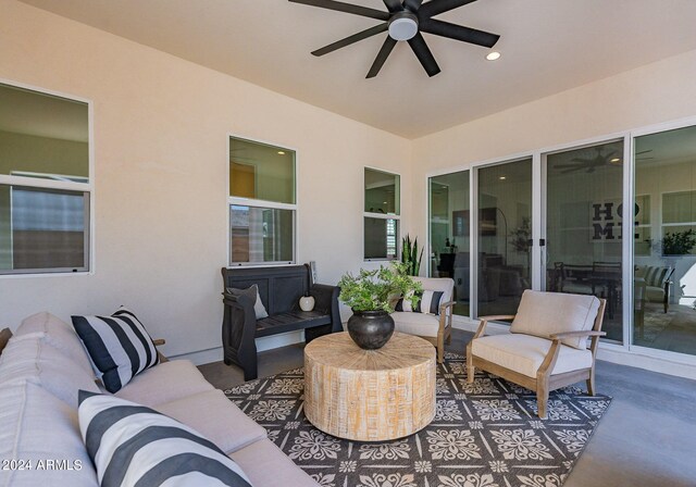 view of patio / terrace featuring ceiling fan and an outdoor living space