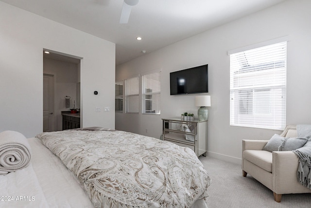 bedroom with light carpet and ceiling fan