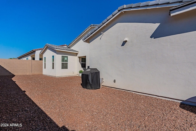 back of property with cooling unit