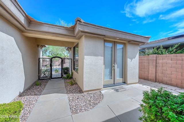 entrance to property featuring french doors