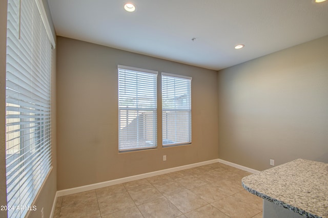 spare room featuring light tile patterned floors