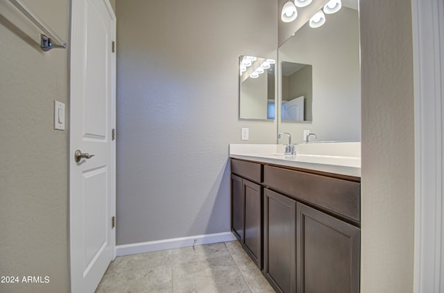 bathroom featuring vanity and tile patterned flooring