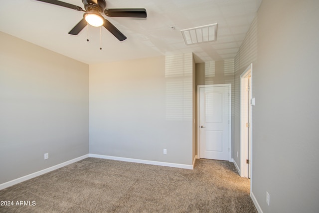 spare room with light carpet and ceiling fan