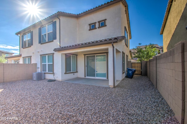 rear view of property featuring a patio