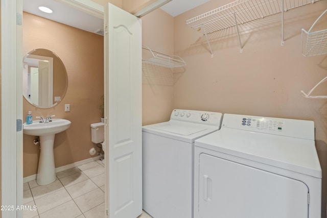 4202 N 21st St Unit 1, Phoenix, AZ 85016 - laundry area featuring light tile patterned floors and washing machine and dryer