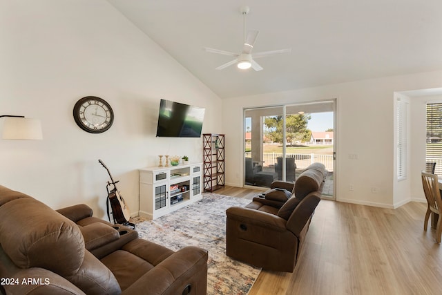 living room featuring high vaulted ceiling, light wood-type flooring, and ceiling fan