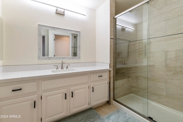 bathroom with vanity and an enclosed shower