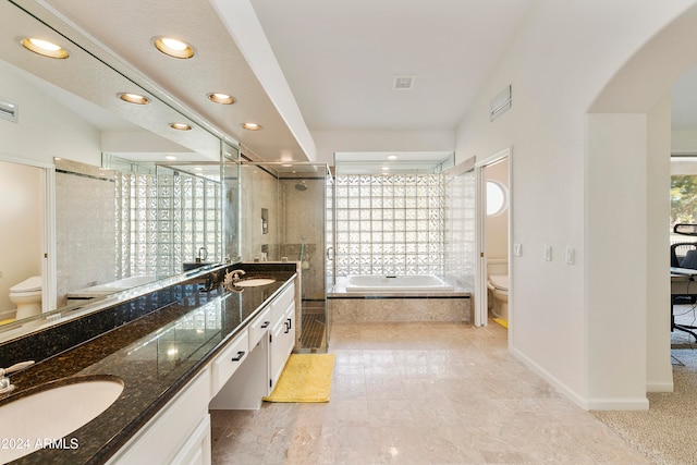 full bathroom with vanity, toilet, and shower with separate bathtub