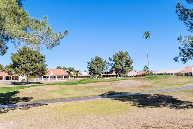 view of property's community featuring a lawn