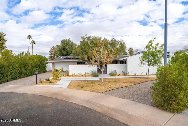 view of front of property with solar panels