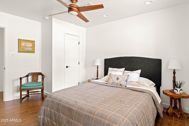 bedroom featuring dark wood-type flooring and ceiling fan