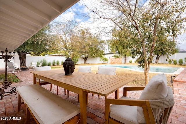 view of patio featuring a fenced in pool